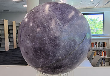 Moon globe on shelf